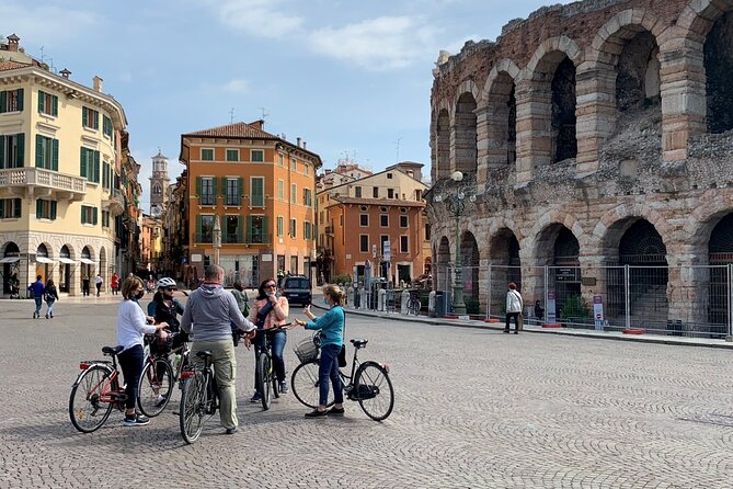 Highlights and hidden gems Verona Bike Tour - Piazza dei Signori and the Adige Direction: Medieval Verona in Motion
