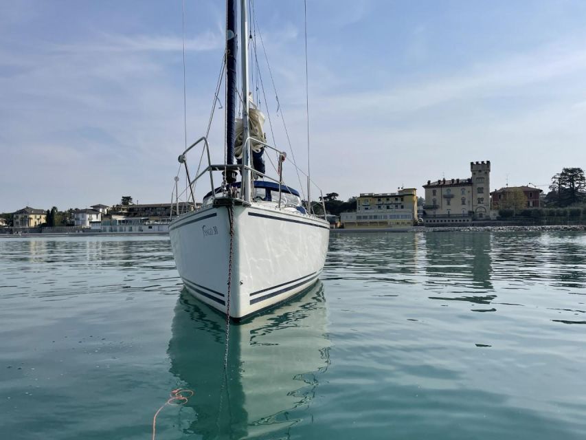 Lake Garda: Afternoon Sailing Trip with Aperitif - Stop near Sirmione: aperitif potential with the Grotte di Catullo area