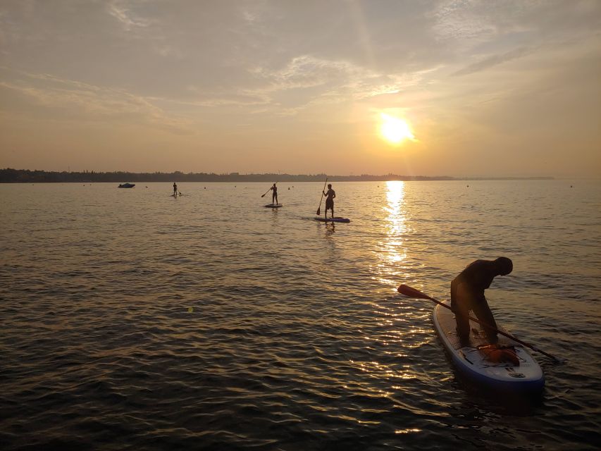 Lake Garda: Stand Up Paddleboard Experience with Dry Bag - The best part: watching sunset from the water with photo help