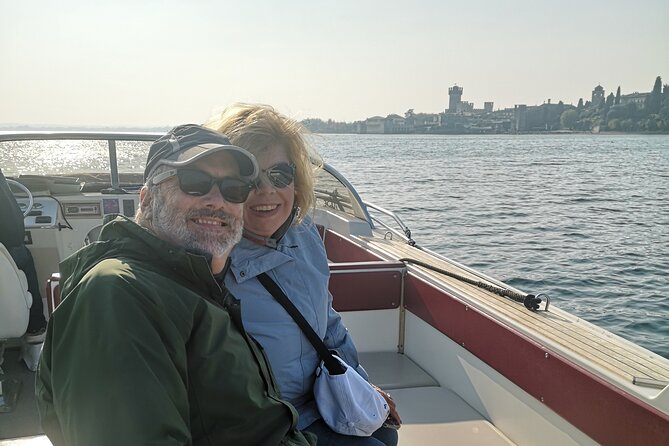 Sirmione away from the Crowds Boat Cruise Guided Walk and a Drink - The 25-seat motorboat loop: 40 minutes around the peninsula