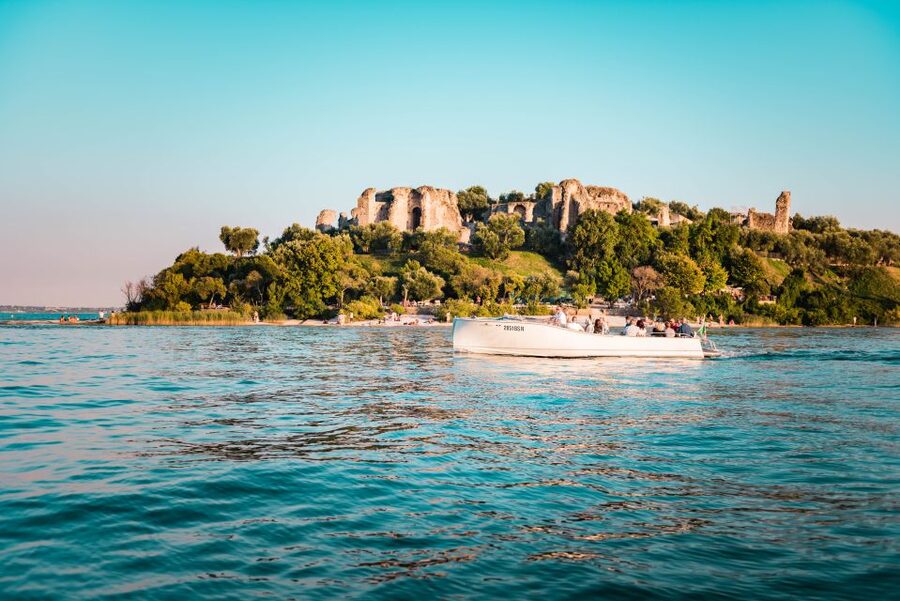 Sirmione: Sunset Boat Cruise with Local Wine - Scaligero Castle From the Water: Bridges and Big-View Drama