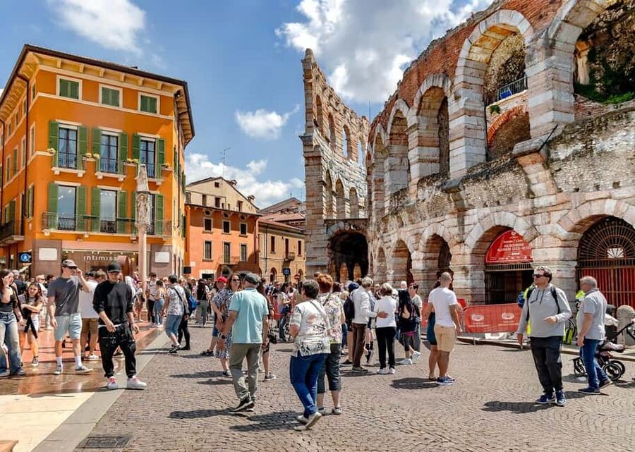 Verona: City Walking Tour with Cable Car & Wine Aperitif - Roman gates and the Arena story around Bra Square