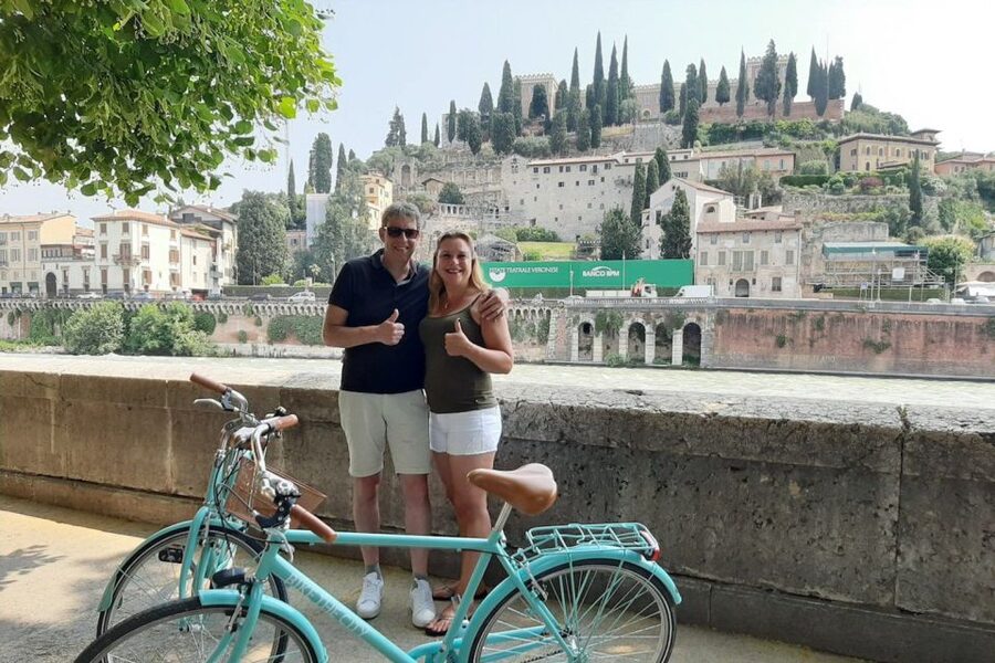 Verona: Highlights and Panorama Bike Tour - Piazza delle Erbe market streets: where Verona feels like Verona