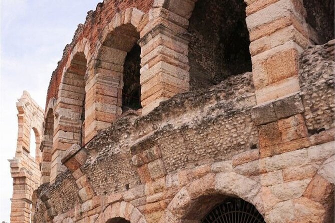 Verona Highlights & Hidden Gems Walking Tour - Porta Borsari and Vicolo del Guasto: Roman walls, then a quieter Verona
